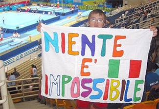 Dario Mosconi proudly displays his handmade banner referring to the Impossible is Nothing contest